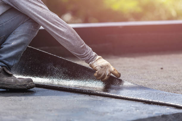 Professional Exterior Waterproofing technician working in Aurora, NY